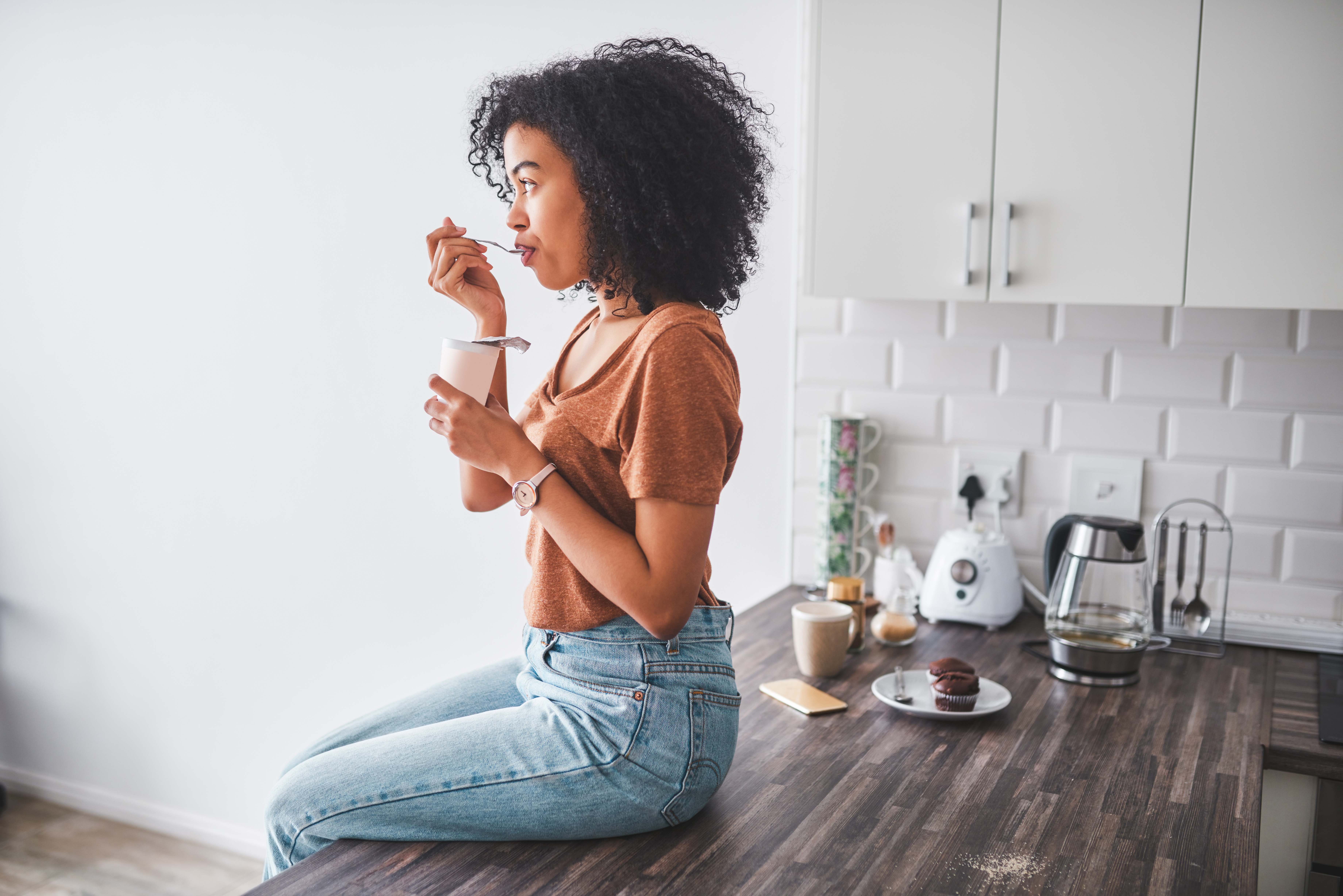 woman eating probiotic yogurt