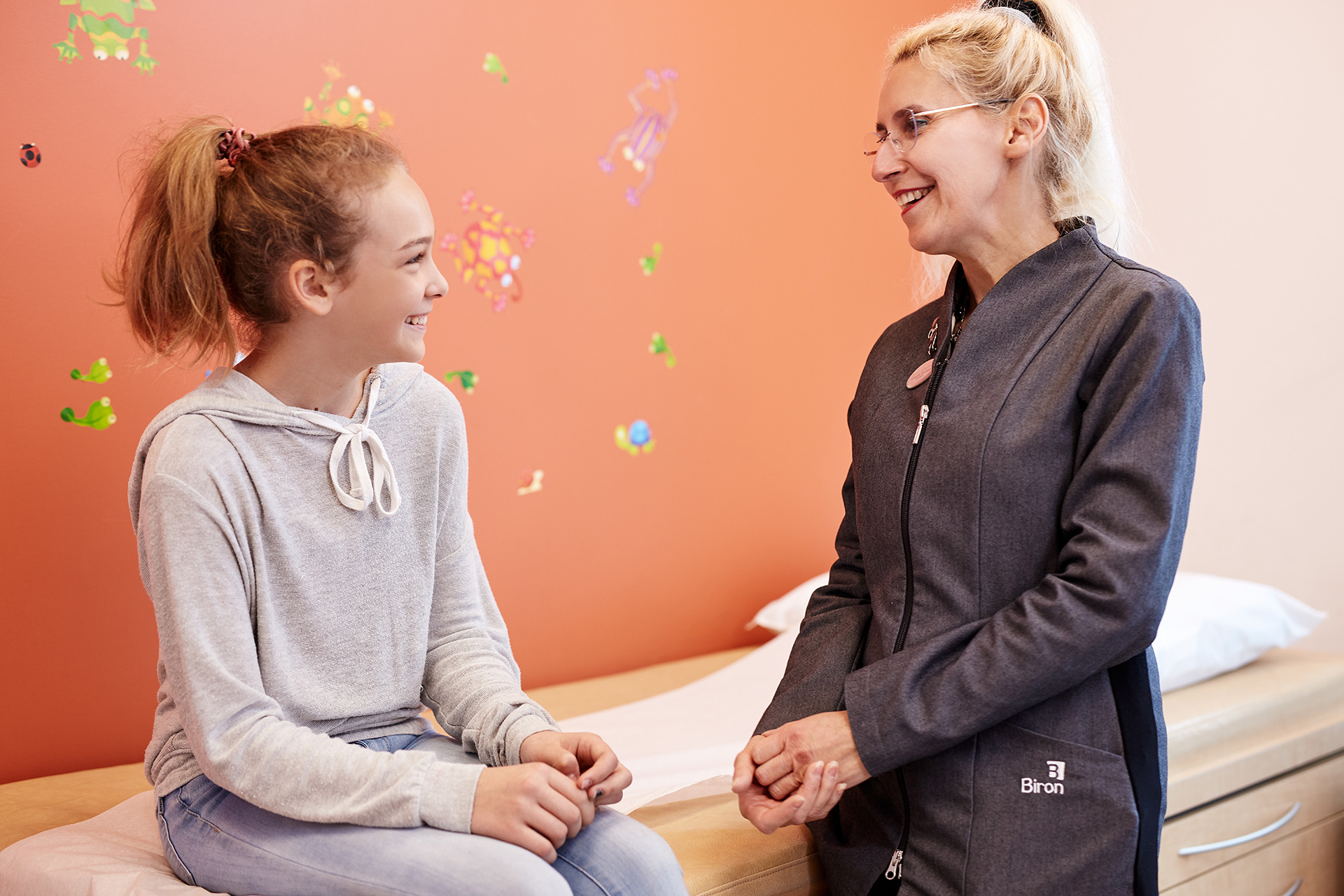 Biron young girl and health professional smiling